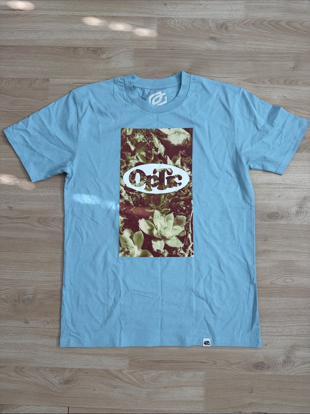 OpTic Mens M Light Blue Graphic Tee with Botanical Panel